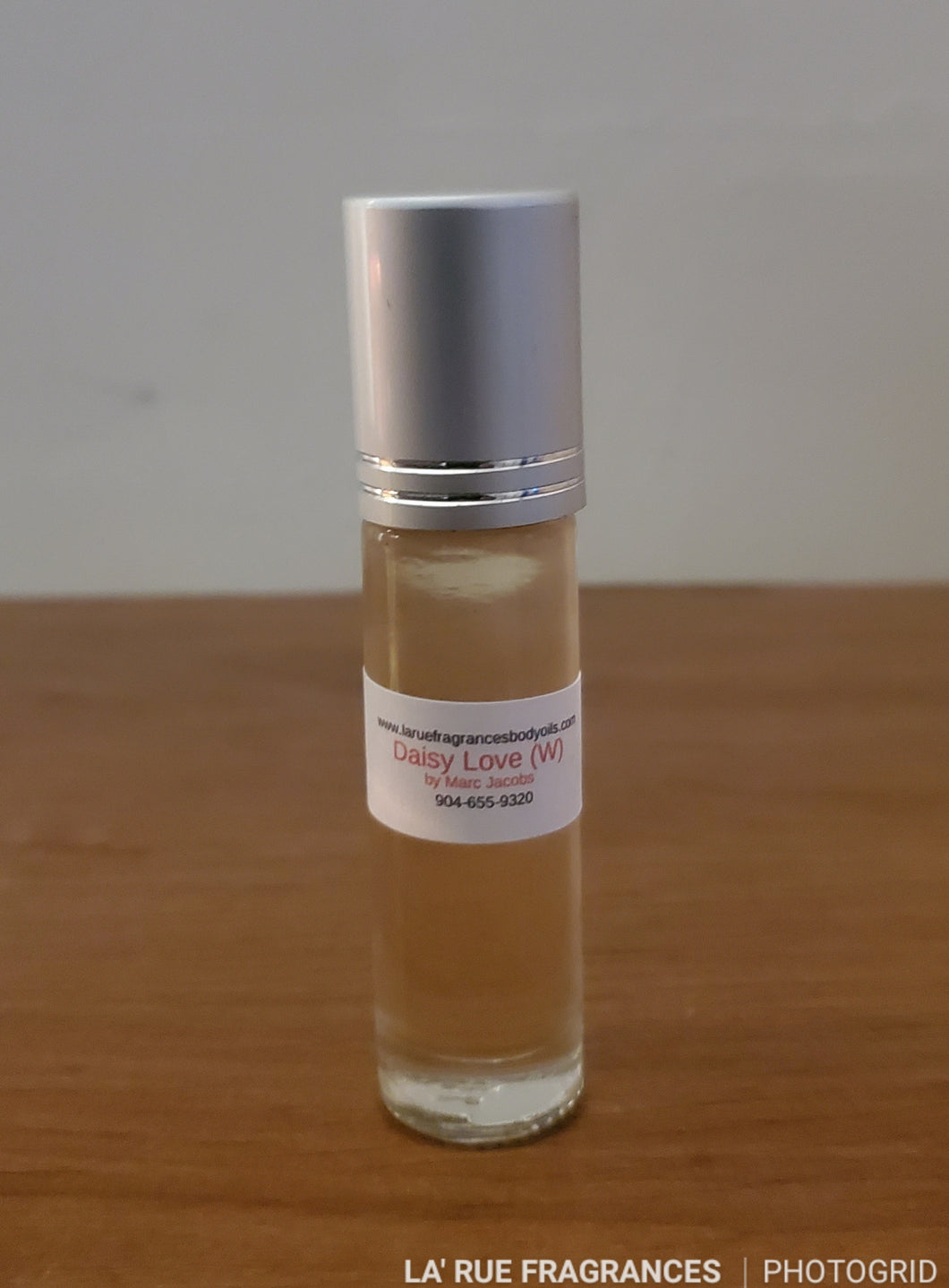 Compare aroma to Daisy Love Marc Jacobs women type 1/3oz roll-on bottle perfume fragrance body oil.  (Women)